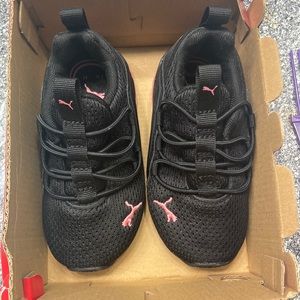 Black and pink pumas